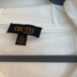 White velour jogging set with gold embellishments.